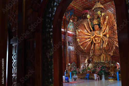 Take photo  large Guan Yin Bodhisattva carved from wood 12 meters high in Wat Metta Photiyan