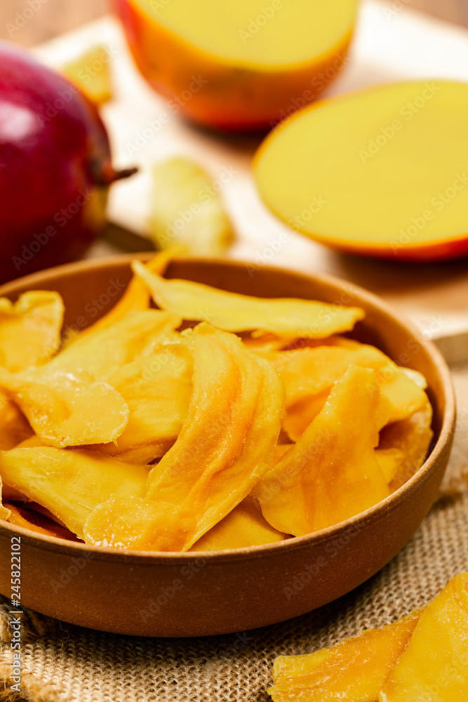Dried Mango Fruit on Wooden Background. Selective focus.