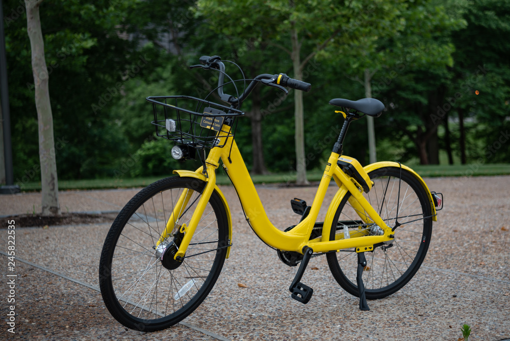 Yellow Bicycle on City Sidewalk