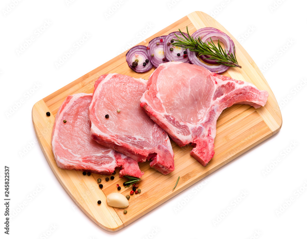 pork chop, steak, pieces of pork on a wooden board. isolate on white background