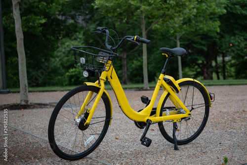 Yellow Bicycle on City Sidewalk