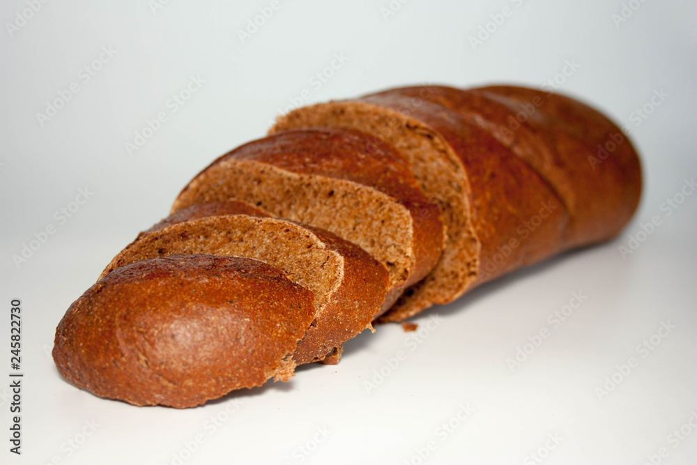 black bread is sliced in pieces. on black bread is sliced in pieces. on
