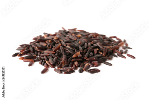 Pile of uncooked black rice on white background