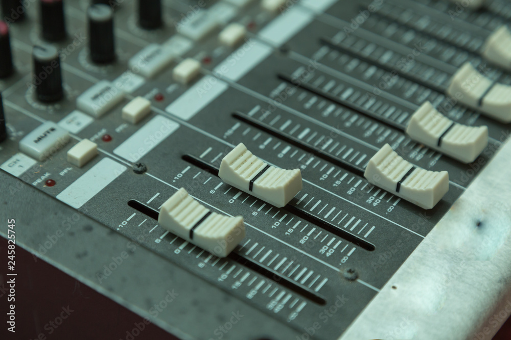 sound mixer with selective focus, buttons equipment in audio recording studio