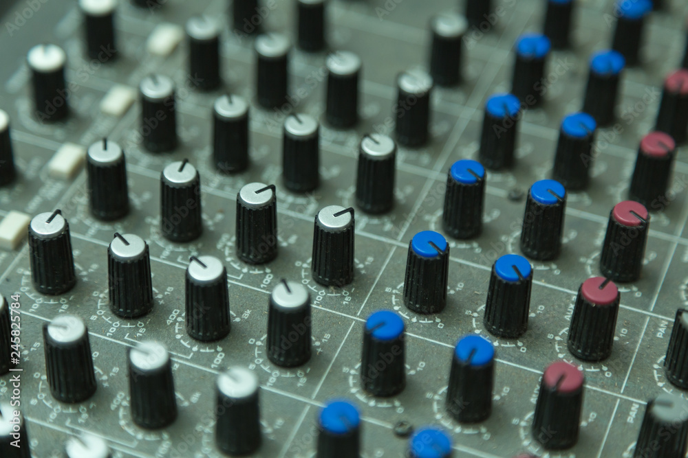 sound mixer with selective focus, buttons equipment in audio recording studio sound mixer with selective focus, buttons equipment in audio recording studio