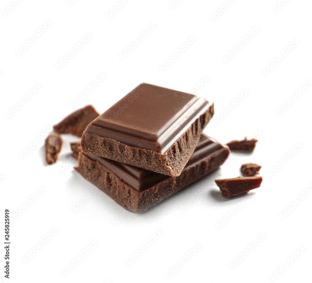 Pieces of tasty milk chocolate on white background Pieces of tasty milk chocolate on white background