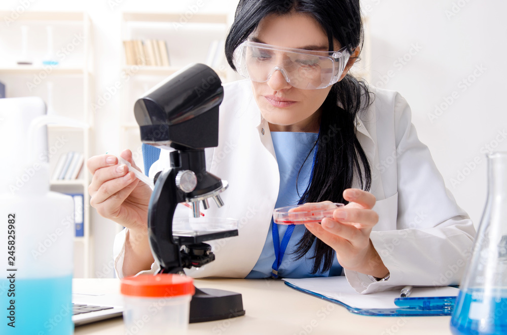 Female chemist working at the lab Female chemist working at the lab