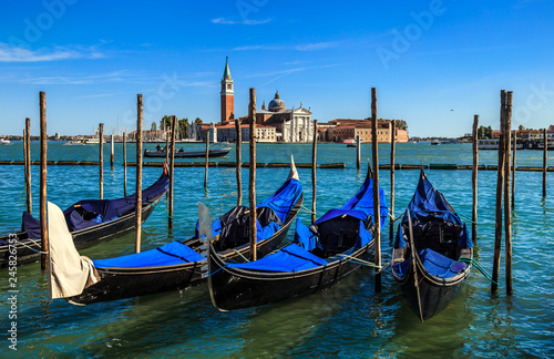 Gondolas on the background of San Giorgio Maggiore island and Cathedral of the same name. View from the waterfront near Saint Mark s square. Venice  Italy.