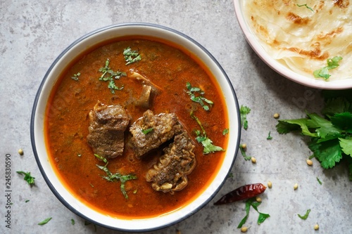 Lamb Mutton goat curry served with Paratha, overhead view