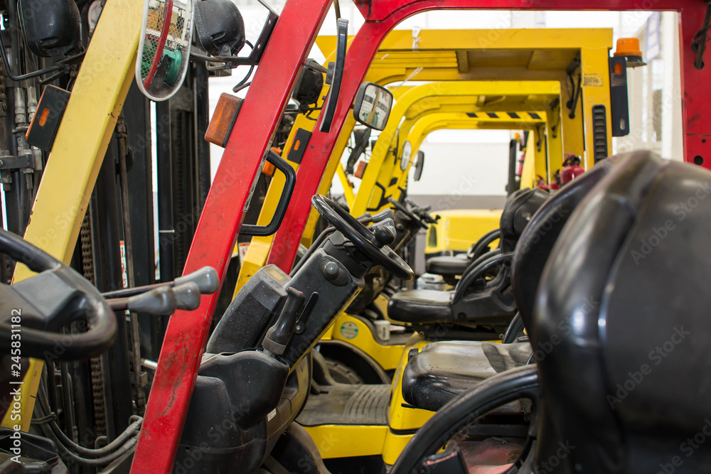 Fototapeta premium Forklifts in warehouse