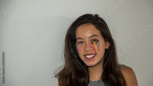 Young Asian teen with colorful tear drop make up