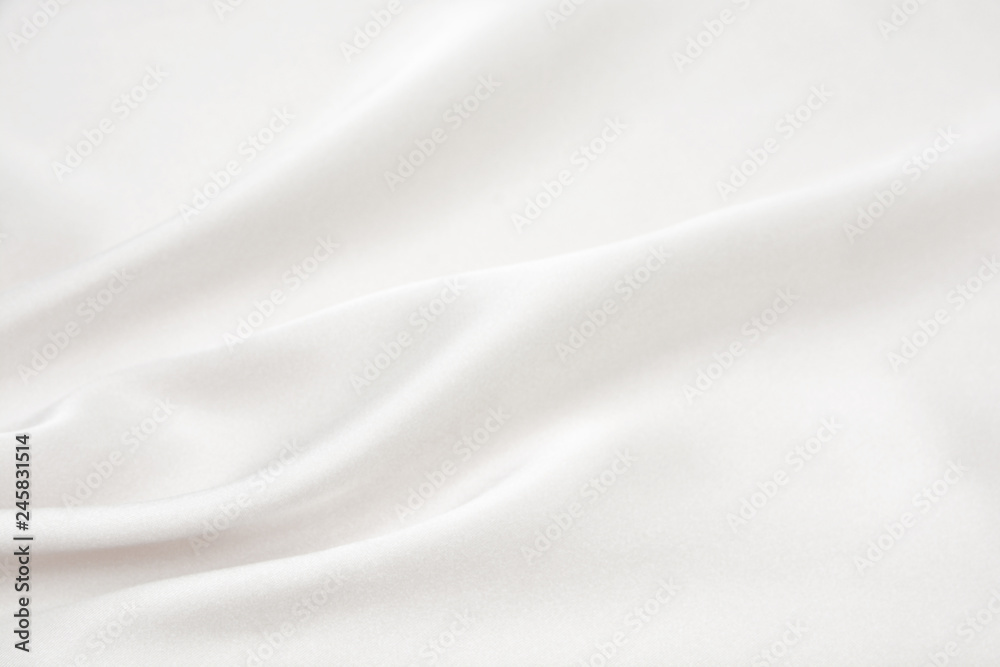 The texture of the satin fabric of white color for the background