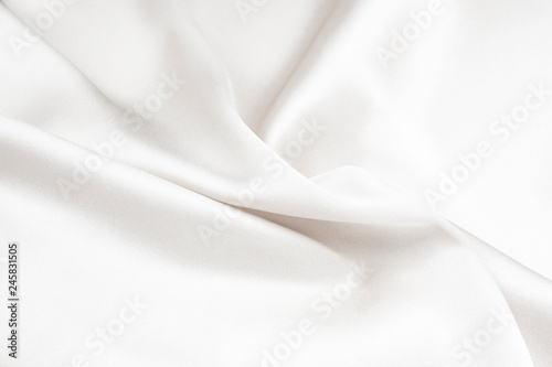 The texture of the satin fabric of white color for the background