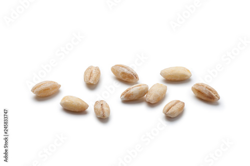 Fototapeta Close-up of peeled barley on white background.