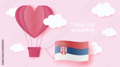 Hot air balloons in shape of heart flying in clouds with national flag of Serbia. Paper art and cut, origami style with love to Serbia photo