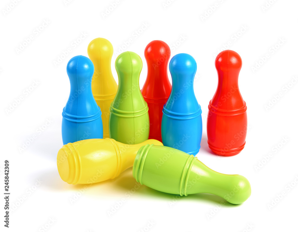 Colorful Plastic Skittles Toy Isolated on White Background. Bowling Game Colorful Plastic Skittles Toy Isolated on White Background. Bowling Game
