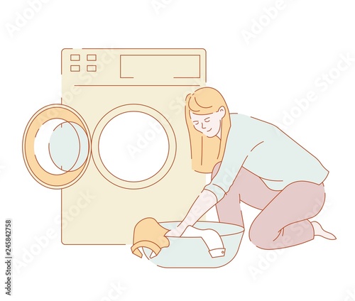 Laundry woman washing clothes in washer housework