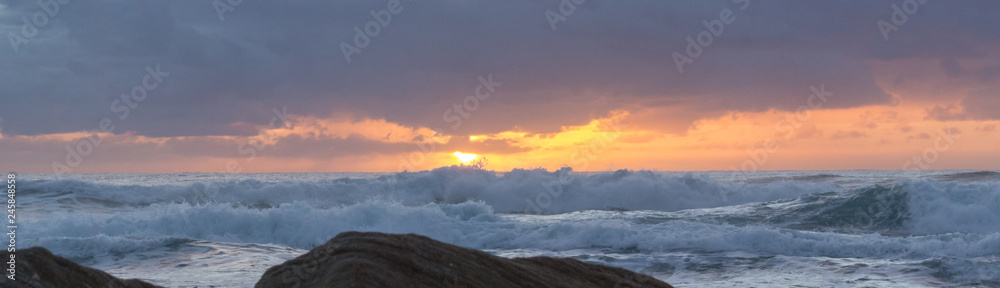 sunrise with clouds and waves 