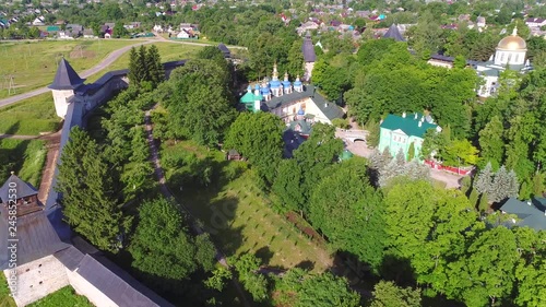 June morning over the Holy Dormition Pskov-Pechersk monastery (aerial video). Pechora, Pskov region photo