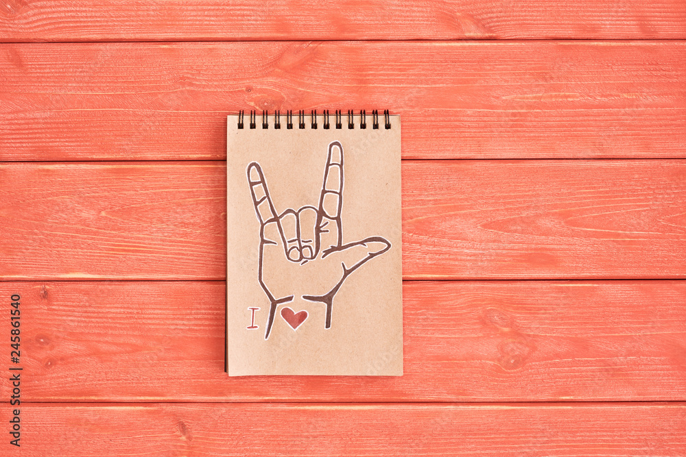 Notebook of Kraft paper with a painted symbol ASL (American Sign ...