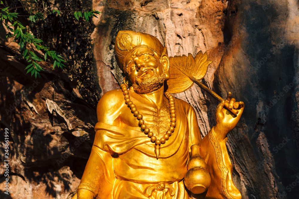 Golden statue of a Chinese god at the Tiger Cave Temple (Wat Tham Seua) in Krabi, Thailand