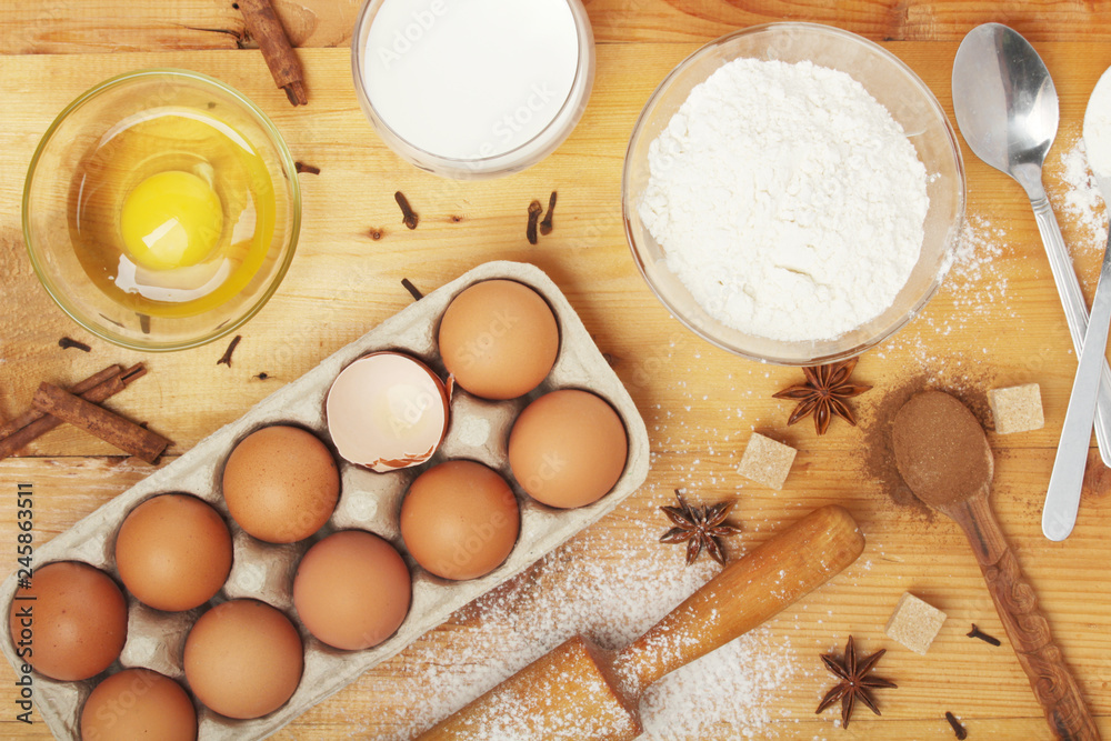 Food ingredients for baking: flour, eggs, milk, sugar Food ingredients for baking: flour, eggs, milk, sugar