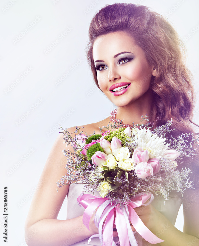 Happy beautiful girl with flowers in hands Happy beautiful girl with flowers in hands