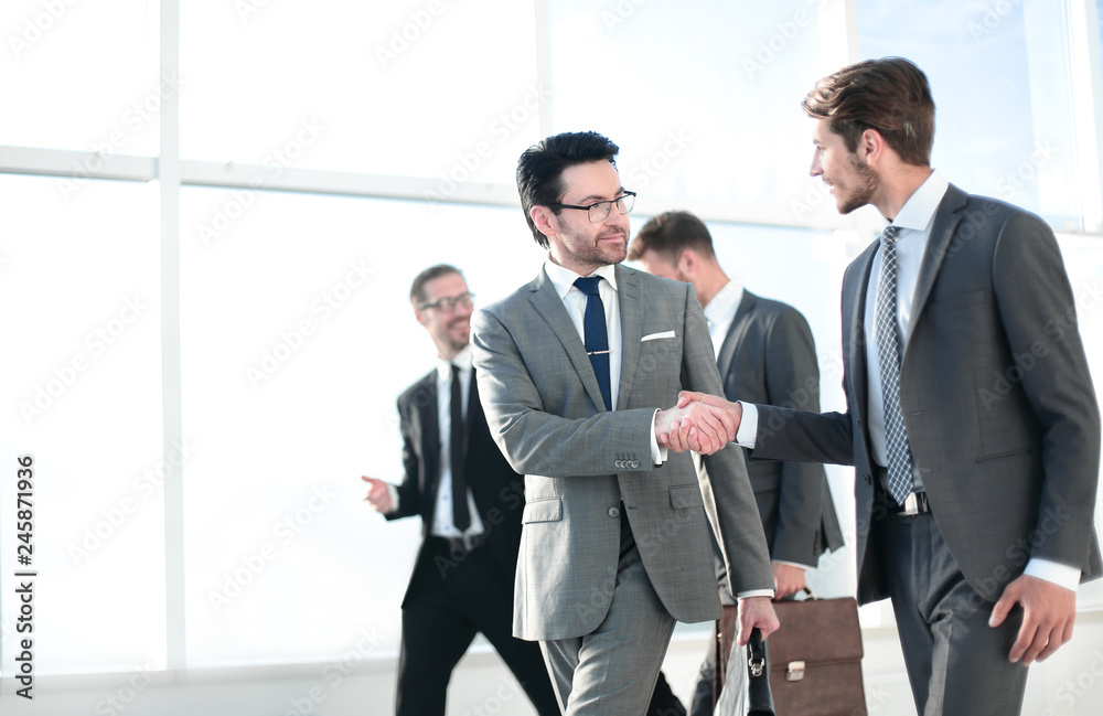 Business people shaking hands, finishing up a meeting