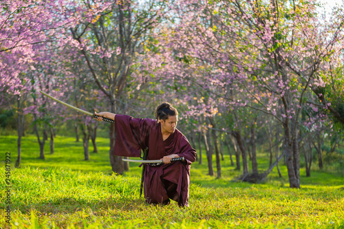 The Japanese samurai are gripping the sword, preparing to fight.