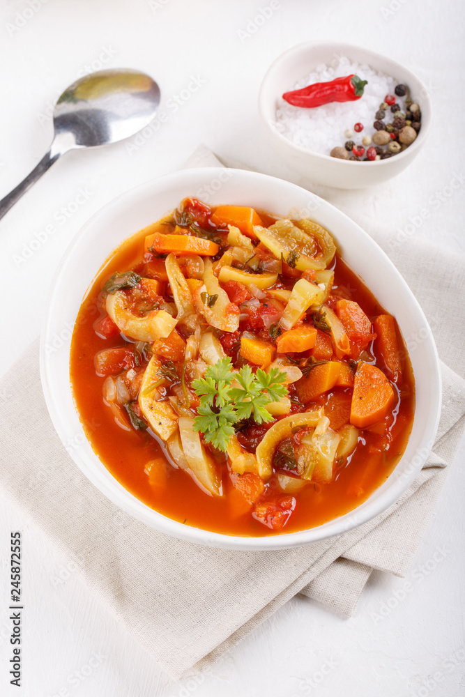 Stewed vegetables. Vegetable ragout of sweet pepper, carrot, onion, tomatoes. Vegetarian food. Stewed vegetables. Vegetable ragout of sweet pepper, carrot, onion, tomatoes. Vegetarian food.