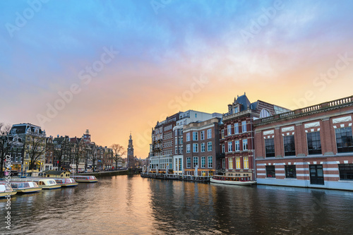 Amsterdam Netherlands, sunset city skyline at canal waterfront