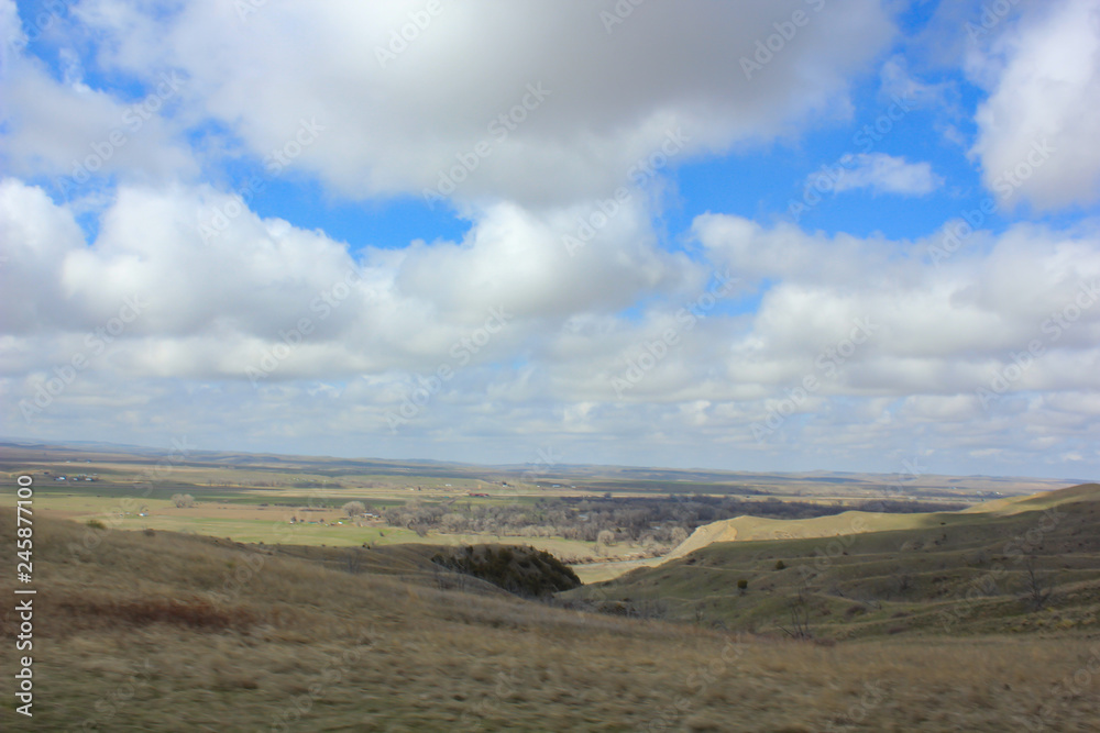 blue sky and clouds over prarie