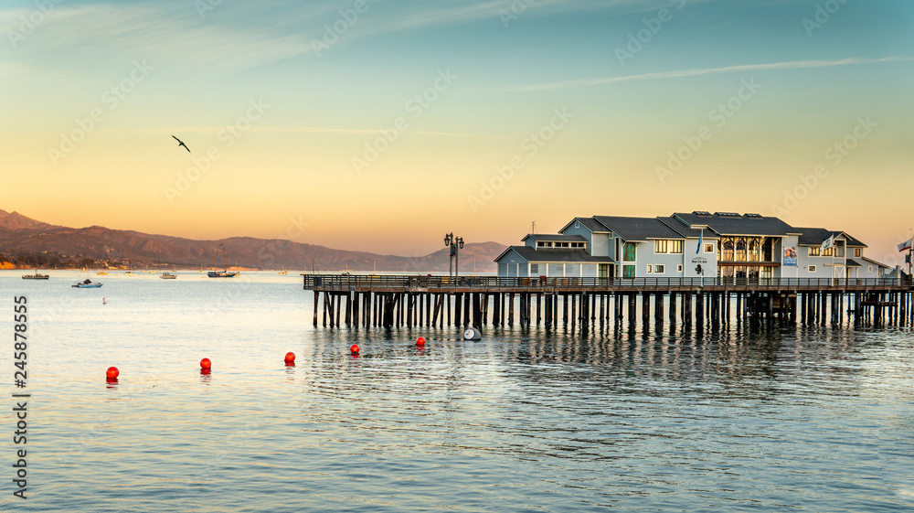Fototapeta premium Sunset on the pier beach