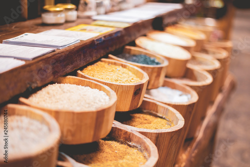 Quadro su tela counter with rows of different grains in the market store f