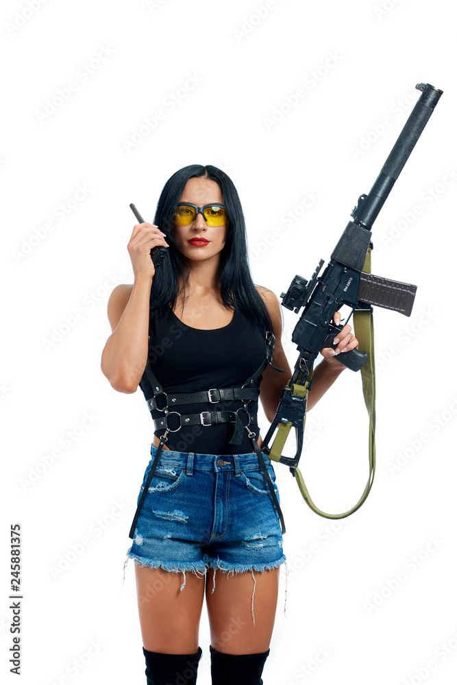 Warrior with weapon in hand talking with somebody via radio. Warrior with weapon in hand talking with somebody via radio.