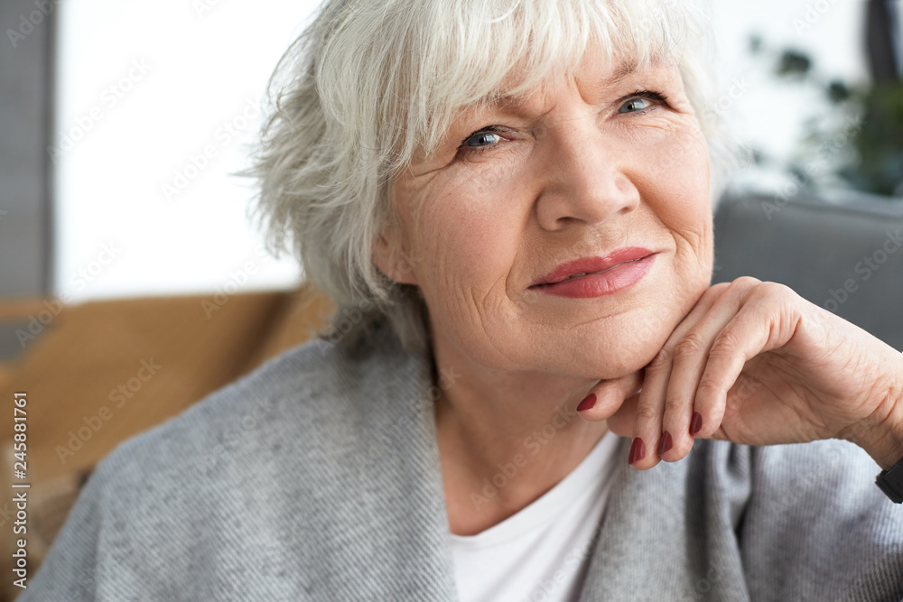 Close up image of adorable charming female pensioner with white short ...
