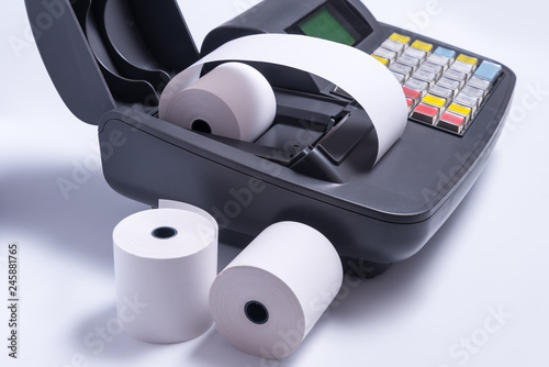 Changing paper roll in electronic cash register machine photo