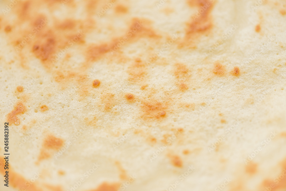 Macro texture of ruddy fresh tasty pancakes