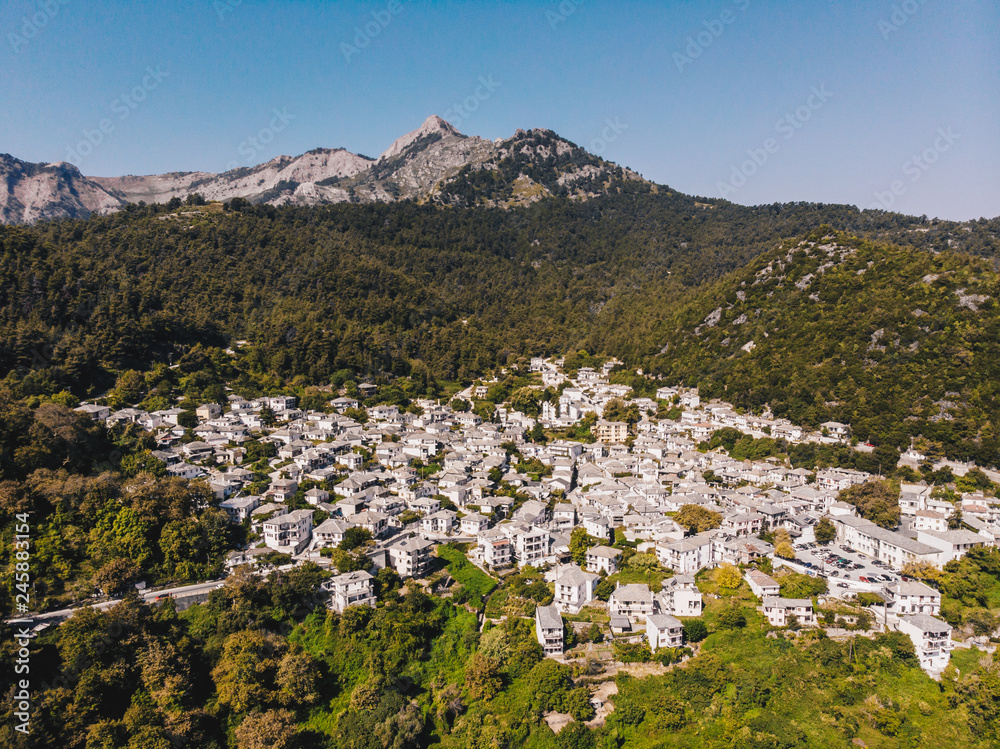 Fototapeta premium Thasos island small town of Panagia in the middle of the island, with houses painted in white and stone roofs, traditional greek way