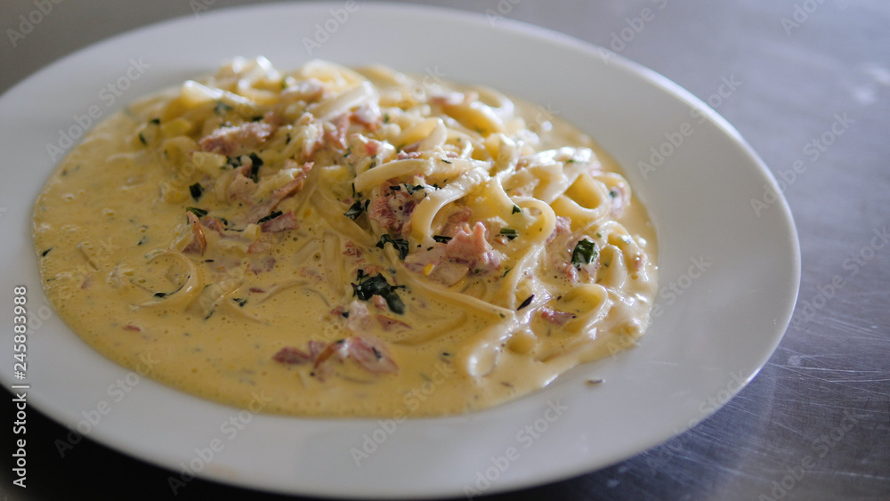 italian food spaghetti carbonara with sauce in a plate italian food spaghetti carbonara with sauce in a plate
