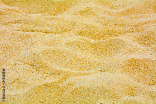 closeup of sand pattern of a beach in the summer