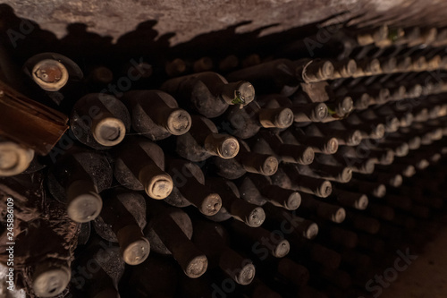 Vintage wine bottles in underground wine cellar in Moldova Republic