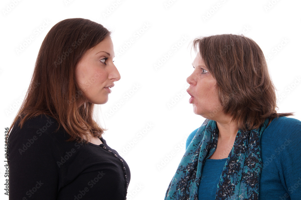mother and daughter having a disgreement, isolated on white mother and daughter having a disgreement, isolated on white