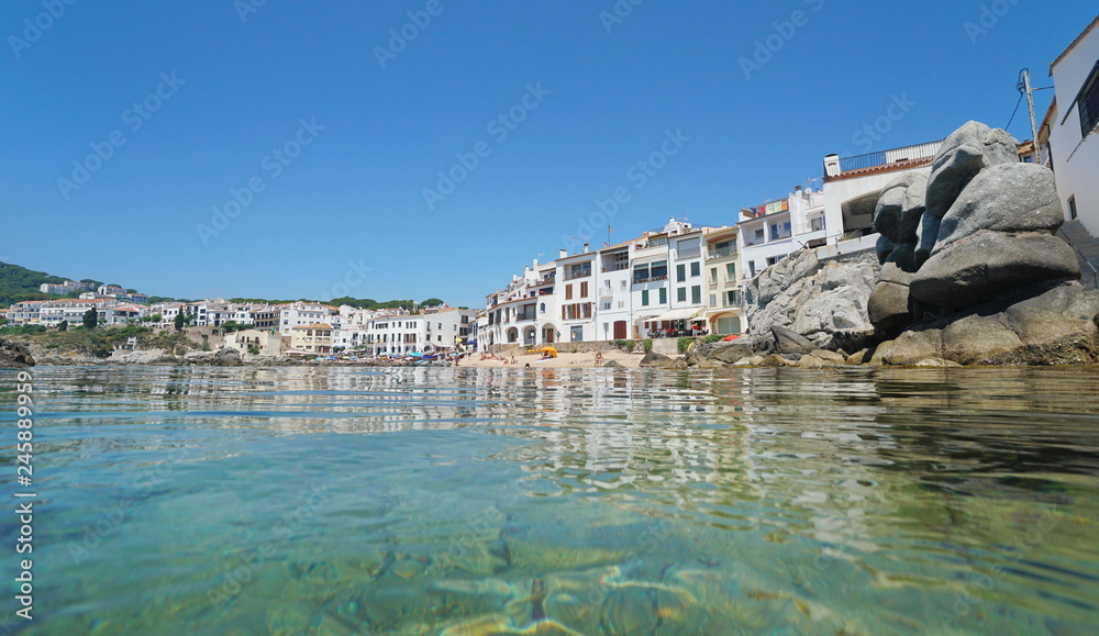 Spain Calella de Palafrugell coastal town, Mediterranean sea, seen from water surface, Catalonia, Costa Brava