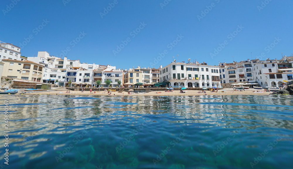 Spain Calella de Palafrugell waterfront Mediterranean village, Catalonia, Costa Brava, En Calau beach, seen from sea surface