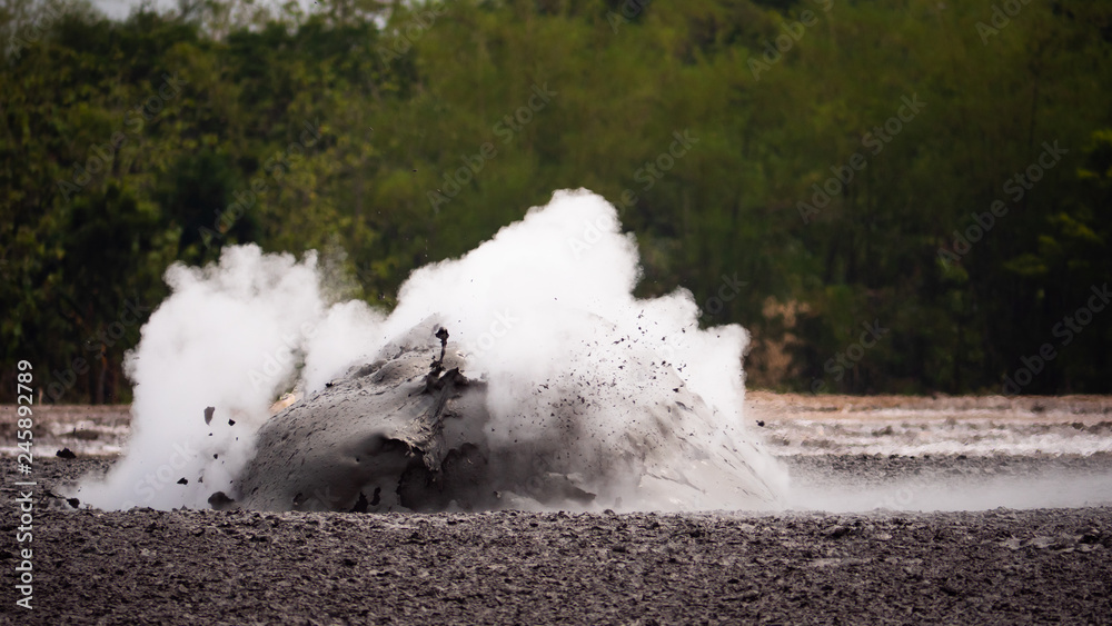 mud volcano with bursting bubble bledug kuwu. volcanic plateau with