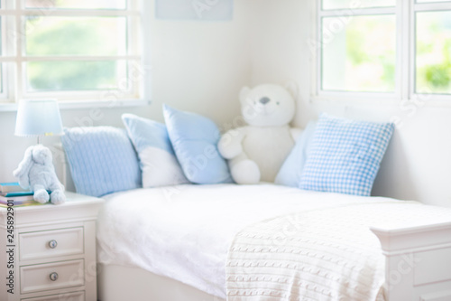 Kids bed in white sunny bedroom