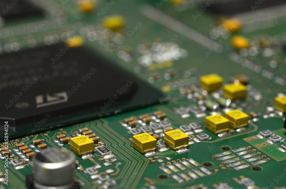 Fototapeta premium detail of components and chip on electronic circuit board