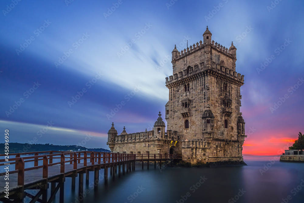 Medieval stone tower in dusky seascape Medieval stone tower in dusky seascape
