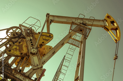 Oil pumpjack, industrial equipment. Rocking machines for power genertion. Extraction of oil. Petroleum concept.